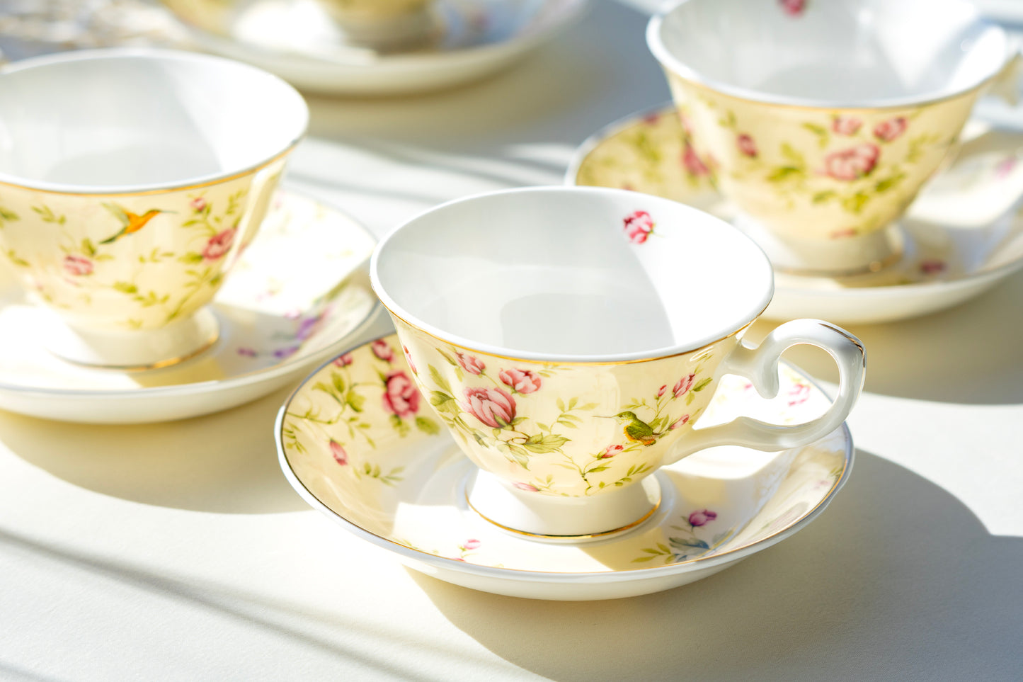 rosebud with hummingbird tea cup